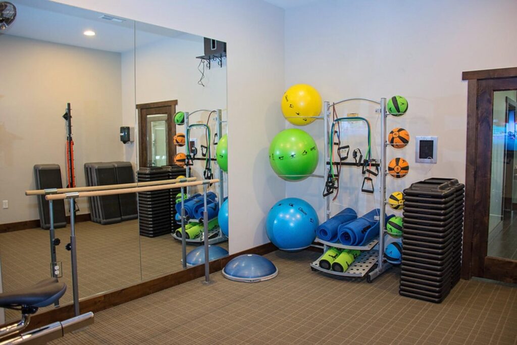 fitness center with yoga mats and exercise balls