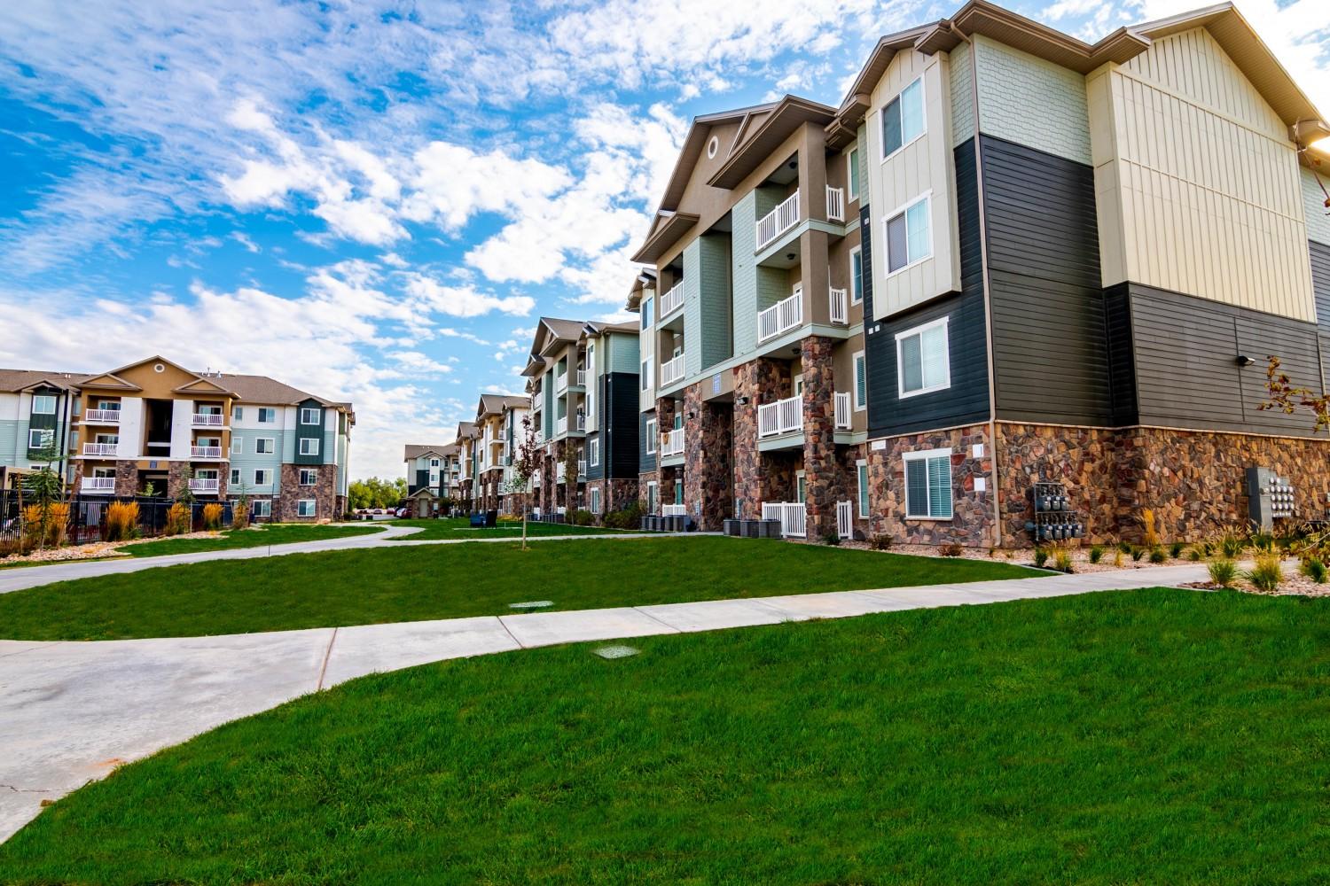 Exterior view of community with parked cars.